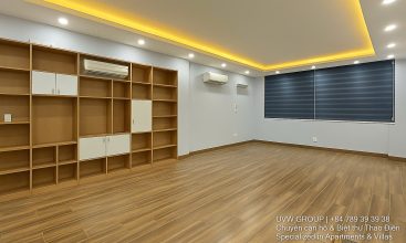 Exterior of a modern 3-storey, 6-bedroom villa for rent in An Phu, District 2 (HCMC), featuring a large garage entrance.