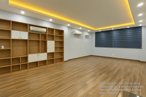 Exterior of a modern 3-storey, 6-bedroom villa for rent in An Phu, District 2 (HCMC), featuring a large garage entrance.