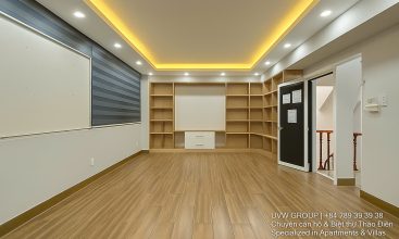 Exterior of a modern 3-storey, 6-bedroom villa for rent in An Phu, District 2 (HCMC), featuring a large garage entrance.