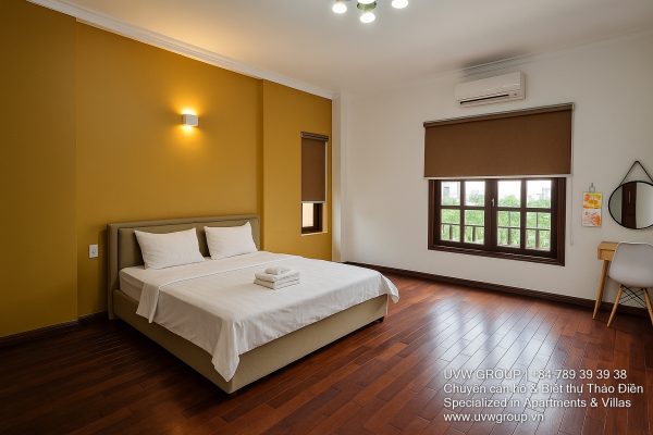 Exterior view of a spacious luxury 7-bedroom villa in Thao Dien, Ho Chi Minh City, featuring a large semi-indoor swimming pool, an elegant living room, a vibrant karaoke lounge with colorful lights, a comfortable king-size bedroom, and modern bathrooms (5 indoor, 3 outdoor).