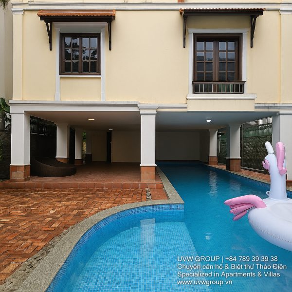 Exterior view of a spacious luxury 7-bedroom villa in Thao Dien, Ho Chi Minh City, featuring a large semi-indoor swimming pool, an elegant living room, a vibrant karaoke lounge with colorful lights, a comfortable king-size bedroom, and modern bathrooms (5 indoor, 3 outdoor).