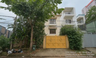 Exterior view of a spacious luxury 7-bedroom villa in Thao Dien, Ho Chi Minh City, featuring a large semi-indoor swimming pool, an elegant living room, a vibrant karaoke lounge with colorful lights, a comfortable king-size bedroom, and modern bathrooms (5 indoor, 3 outdoor).