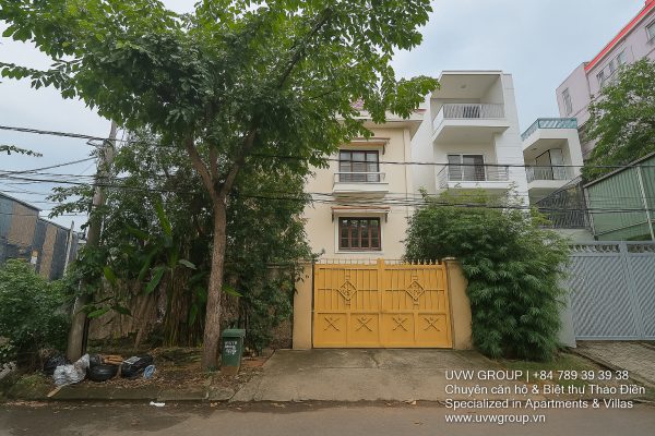 Exterior view of a spacious luxury 7-bedroom villa in Thao Dien, Ho Chi Minh City, featuring a large semi-indoor swimming pool, an elegant living room, a vibrant karaoke lounge with colorful lights, a comfortable king-size bedroom, and modern bathrooms (5 indoor, 3 outdoor).