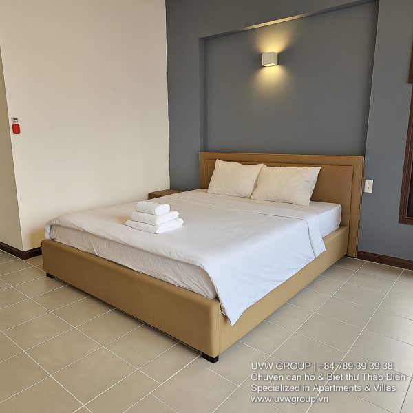 Exterior view of a spacious luxury 7-bedroom villa in Thao Dien, Ho Chi Minh City, featuring a large semi-indoor swimming pool, an elegant living room, a vibrant karaoke lounge with colorful lights, a comfortable king-size bedroom, and modern bathrooms (5 indoor, 3 outdoor).