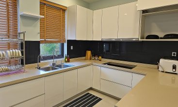 Image of a stunning luxury 4-bedroom villa for short-term rent in Ho Chi Minh City, showcasing its private indoor swimming pool and stylish, fully furnished resort-style interiors.