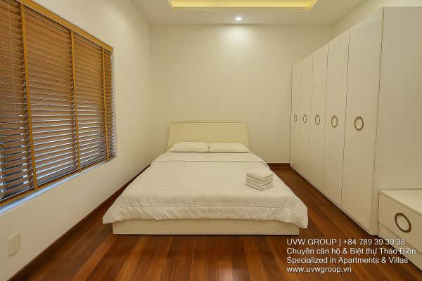 Image of a stunning luxury 4-bedroom villa for short-term rent in Ho Chi Minh City, showcasing its private indoor swimming pool and stylish, fully furnished resort-style interiors.