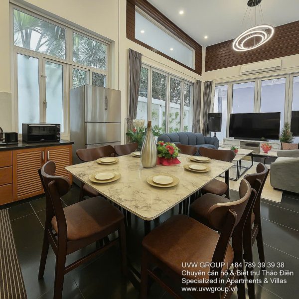 Exterior and interior views of a modern luxury 4-bedroom villa for rent in Thao Dien, Ho Chi Minh City, showcasing a stylish semi-indoor swimming pool, an open-plan living room with integrated karaoke and BBQ service area, a comfortable king-size bedroom, and 5 contemporary bathrooms (4 indoor, 1 outdoor).