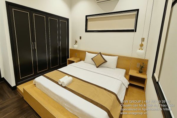 Exterior and interior views of a modern luxury 5-bedroom villa for rent in Thao Dien, Ho Chi Minh City, featuring a unique indoor swimming pool with wooden deck, a stylish living room, a dedicated karaoke room, a king-size bedroom, and 6 contemporary bathrooms (4 indoor, 2 outdoor).