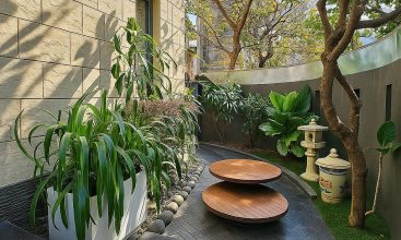 Exterior and interior views of a modern luxury 5-bedroom villa for rent in Thao Dien, Ho Chi Minh City, featuring a unique indoor swimming pool with wooden deck, a stylish living room, a dedicated karaoke room, a king-size bedroom, and 6 contemporary bathrooms (4 indoor, 2 outdoor).