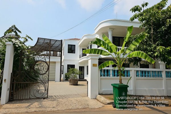 Front view of a 5-bedroom luxury villa with private indoor swimming pool, king-size beds, karaoke room, and modern interiors for short-term rent in Thao Dien, District 2, Ho Chi Minh City.