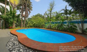 Front view of a 5-bedroom luxury villa with private indoor swimming pool, king-size beds, karaoke room, and modern interiors for short-term rent in Thao Dien, District 2, Ho Chi Minh City.