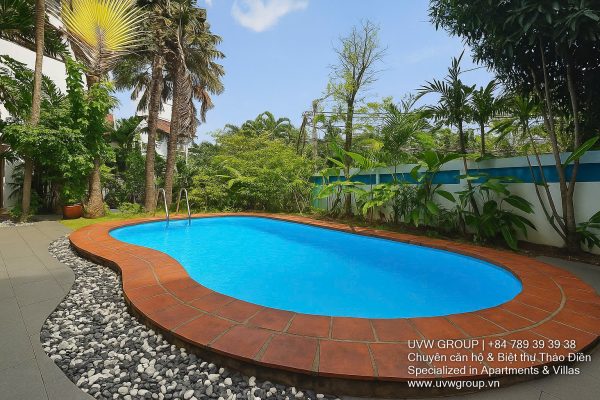 Front view of a 5-bedroom luxury villa with private indoor swimming pool, king-size beds, karaoke room, and modern interiors for short-term rent in Thao Dien, District 2, Ho Chi Minh City.