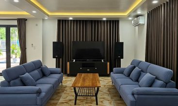 Front view of a 5-bedroom luxury villa with private indoor swimming pool, king-size beds, karaoke room, and modern interiors for short-term rent in Thao Dien, District 2, Ho Chi Minh City.