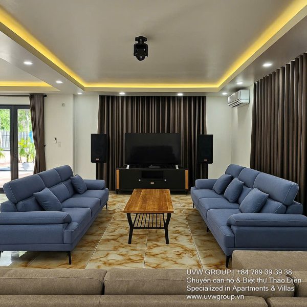 Front view of a 5-bedroom luxury villa with private indoor swimming pool, king-size beds, karaoke room, and modern interiors for short-term rent in Thao Dien, District 2, Ho Chi Minh City.