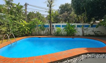Front view of a 5-bedroom luxury villa with private indoor swimming pool, king-size beds, karaoke room, and modern interiors for short-term rent in Thao Dien, District 2, Ho Chi Minh City.