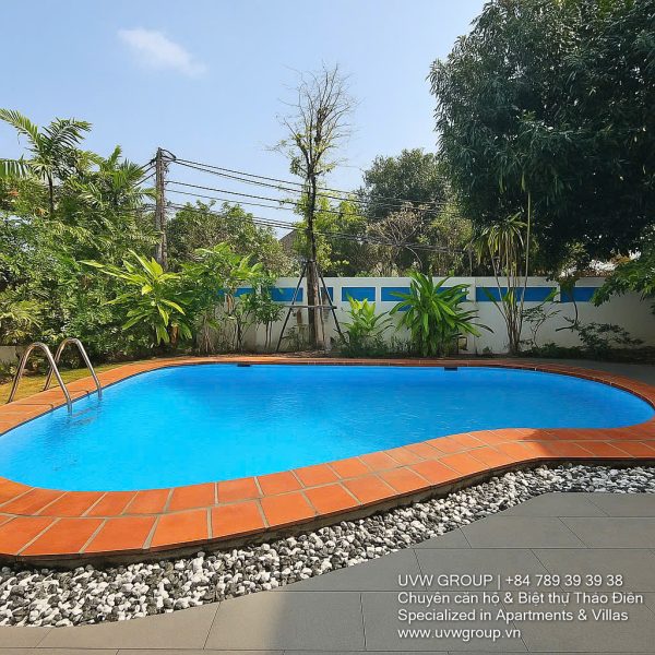 Front view of a 5-bedroom luxury villa with private indoor swimming pool, king-size beds, karaoke room, and modern interiors for short-term rent in Thao Dien, District 2, Ho Chi Minh City.