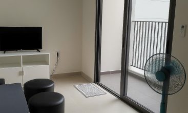 Fully furnished living room with Saigon River view in Masteri Thao Dien 2BR corner apartment for rent, District 2 HCMC.