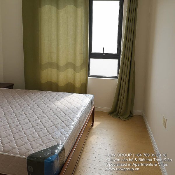 Fully furnished living room with Saigon River view in Masteri Thao Dien 2BR corner apartment for rent, District 2 HCMC.