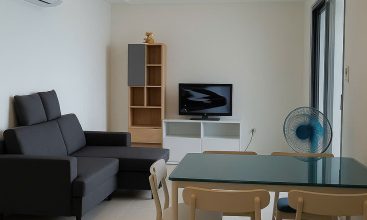Fully furnished living room with Saigon River view in Masteri Thao Dien 2BR corner apartment for rent, District 2 HCMC.
