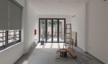 Modern 3-storey office building for rent in Thao Dien with 2 frontages, glass windows, and rooftop terrace