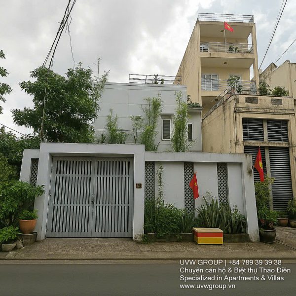 Exterior view of a spacious 3-storey house available for rent in Thao Dien, Ho Chi Minh City, featuring front garden space and traditional tiled roof.
