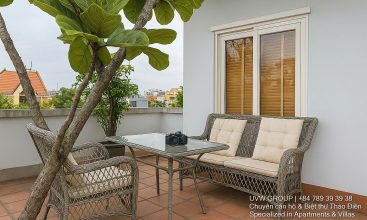 Exterior view of a spacious 3-storey house available for rent in Thao Dien, Ho Chi Minh City, featuring front garden space and traditional tiled roof.