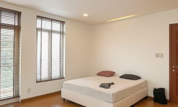 Exterior view of a spacious 3-storey house available for rent in Thao Dien, Ho Chi Minh City, featuring front garden space and traditional tiled roof.