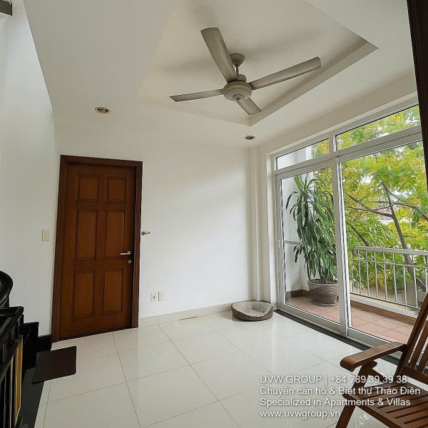 Exterior view of a spacious 3-storey house available for rent in Thao Dien, Ho Chi Minh City, featuring front garden space and traditional tiled roof.