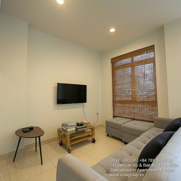 Exterior view of a spacious 3-storey house available for rent in Thao Dien, Ho Chi Minh City, featuring front garden space and traditional tiled roof.